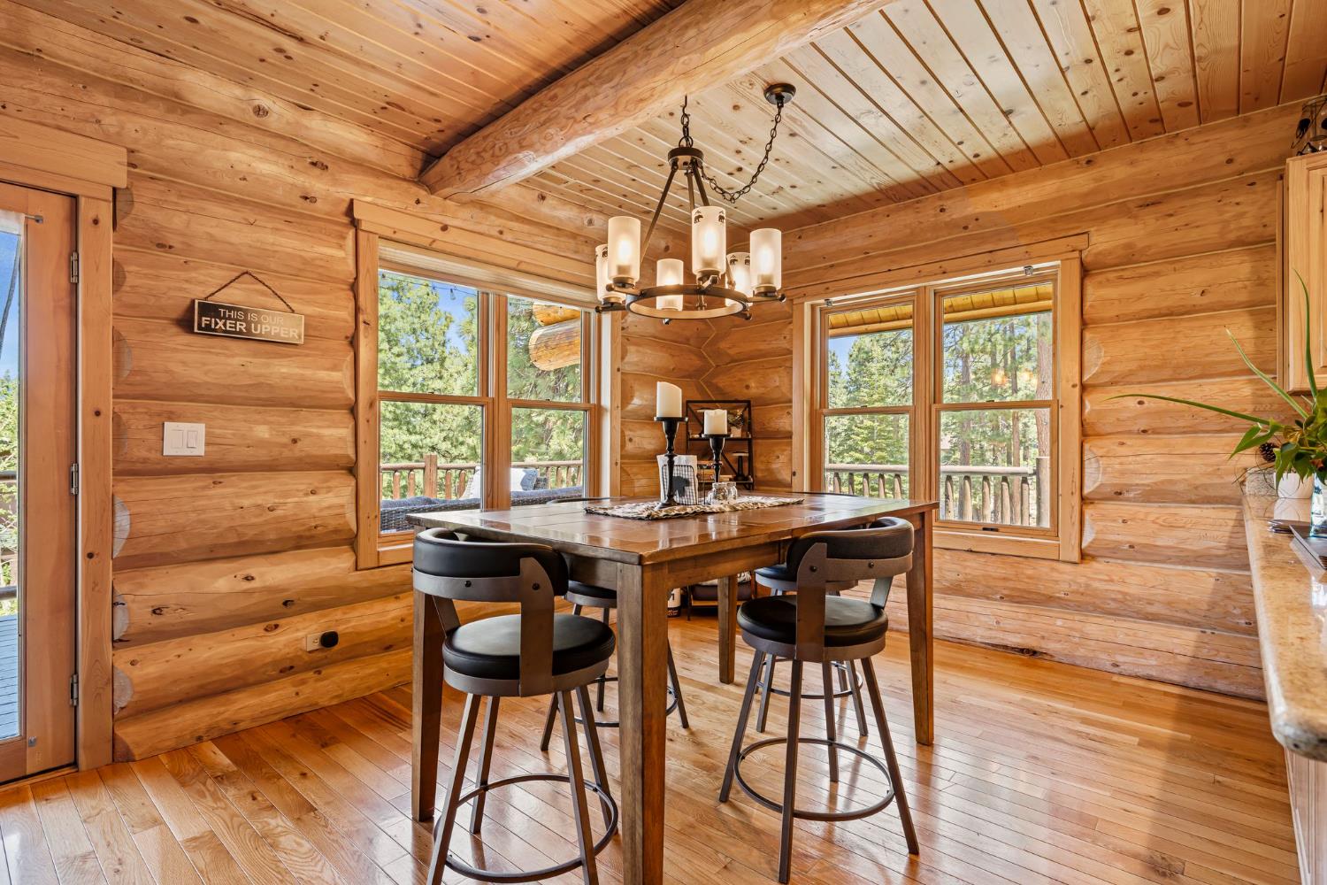 3589 Rocky Point Road South Lake Tahoe, CA 96150 - Photo 5 of 95 a view of a dining room with furniture wooden floor and chandelier