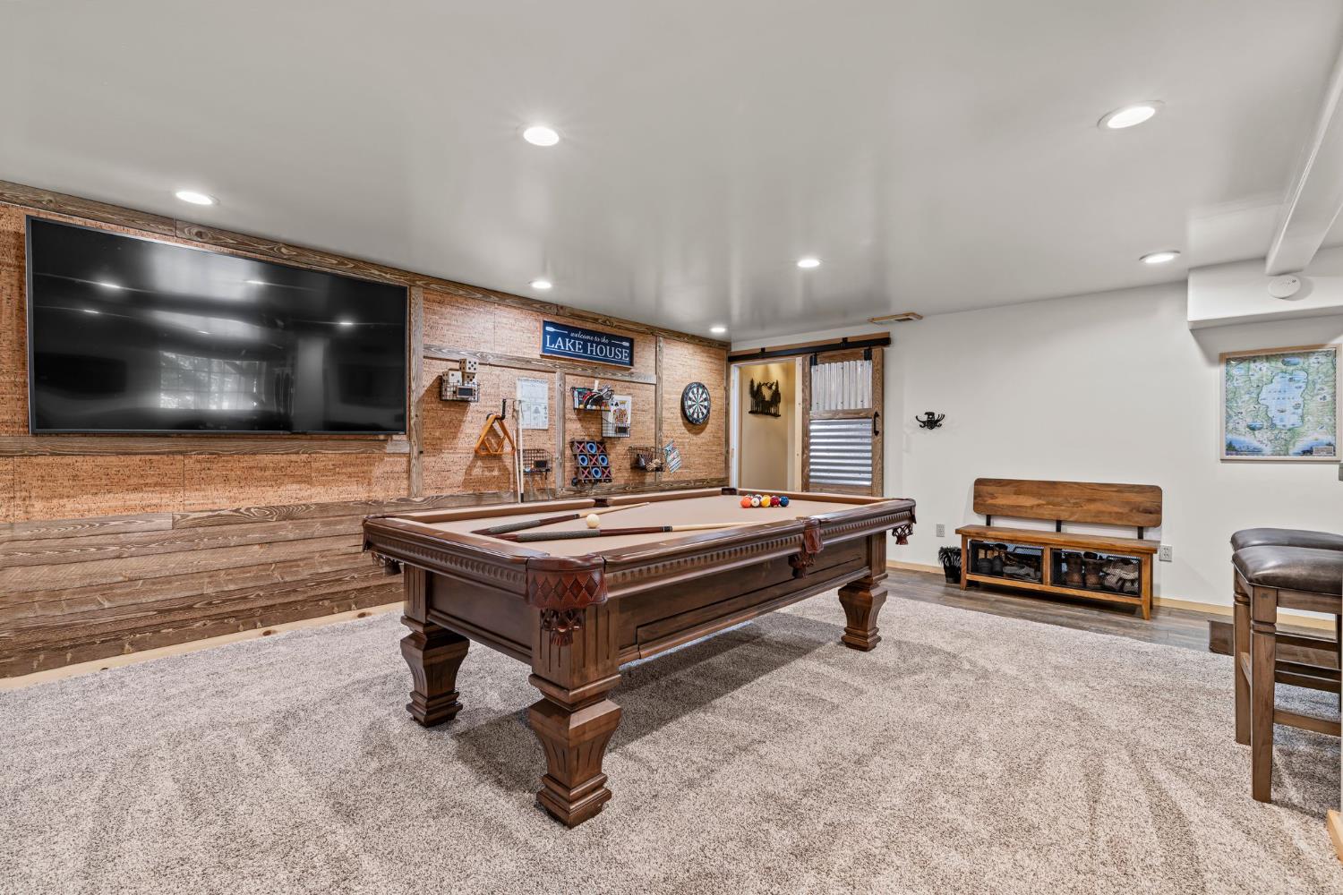 3589 Rocky Point Road South Lake Tahoe, CA 96150 - Photo 52 of 95 a living room with furniture and a flat screen tv