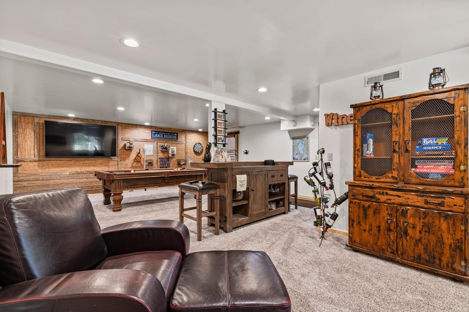 3589 Rocky Point Road South Lake Tahoe, CA 96150 - Photo 57 of 95 a living room with furniture and a flat screen tv