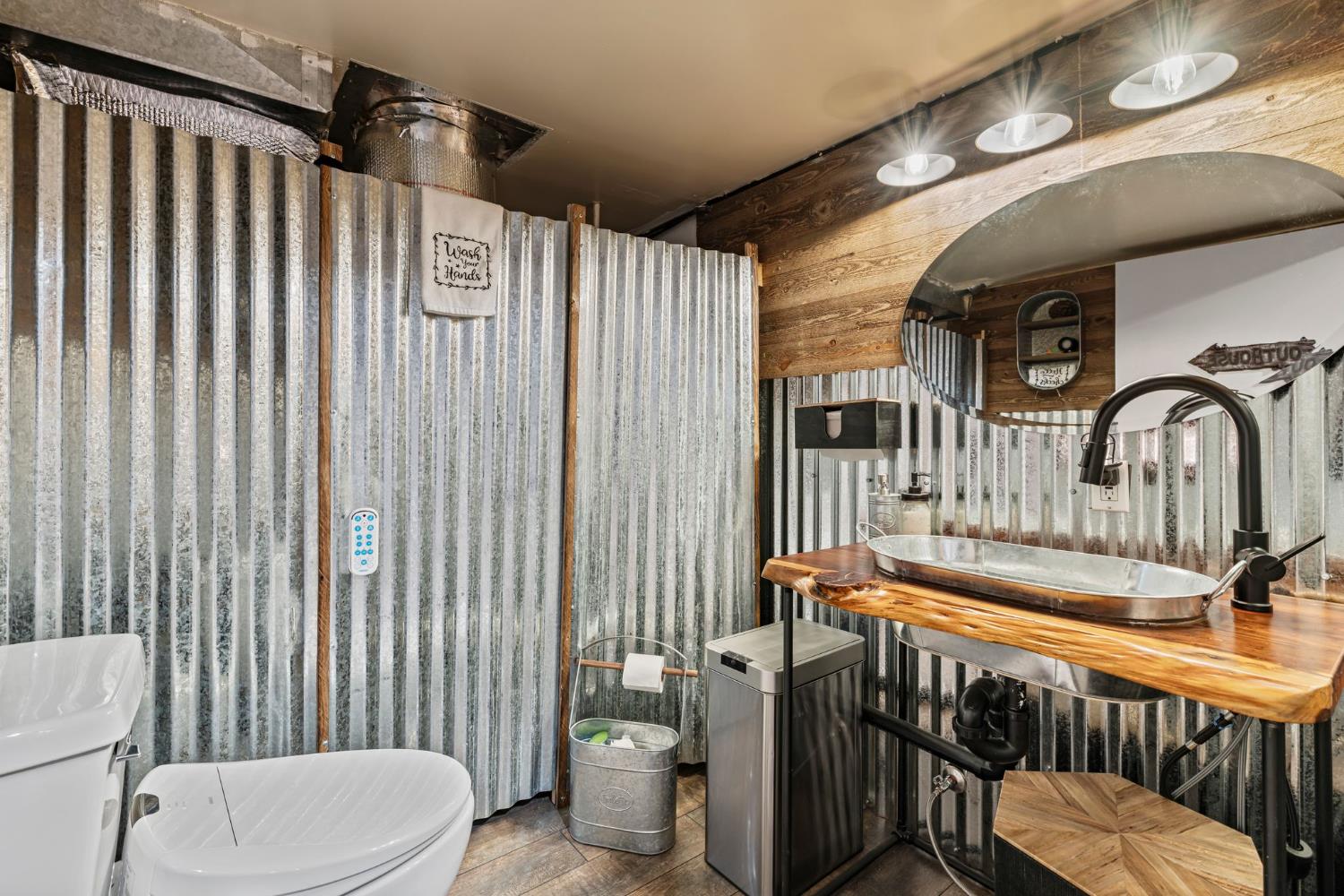 3589 Rocky Point Road South Lake Tahoe, CA 96150 - Photo 59 of 95 a bathroom with a toilet a sink and bathtub