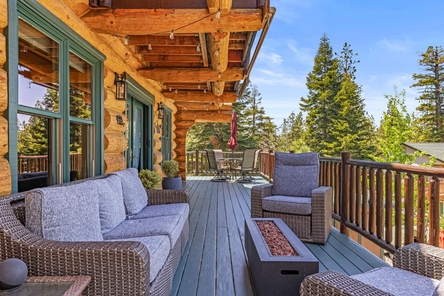 3589 Rocky Point Road South Lake Tahoe, CA 96150 - Photo 64 of 95 a view of a rooftop deck with couch and chairs