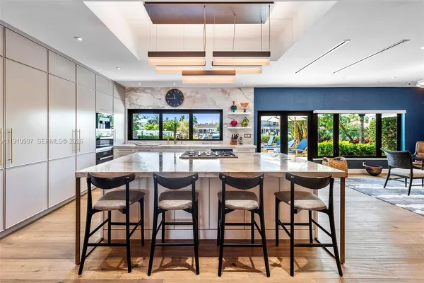 a kitchen with a table and chairs in it