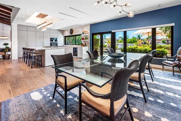a view of a dining room with furniture window and outside view
