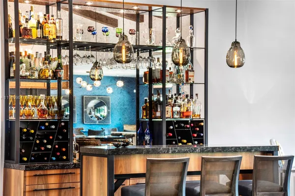 a kitchen with a table and chairs in it