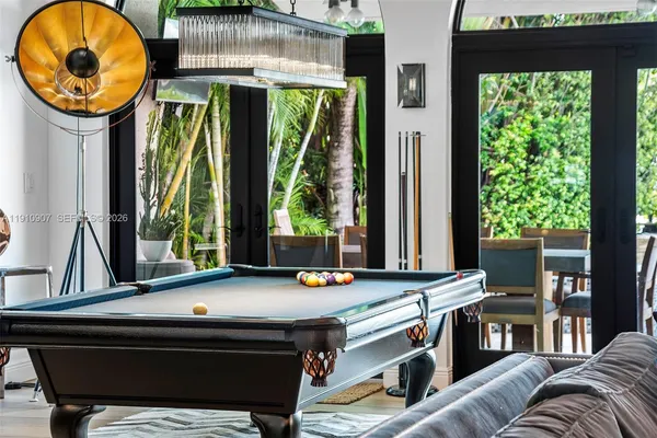 a living room filled with furniture and a large window