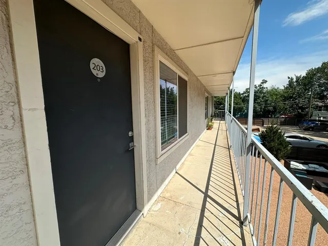 a view of balcony with furniture