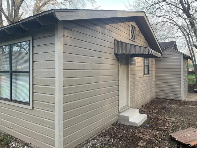 a view of a back yard of the house