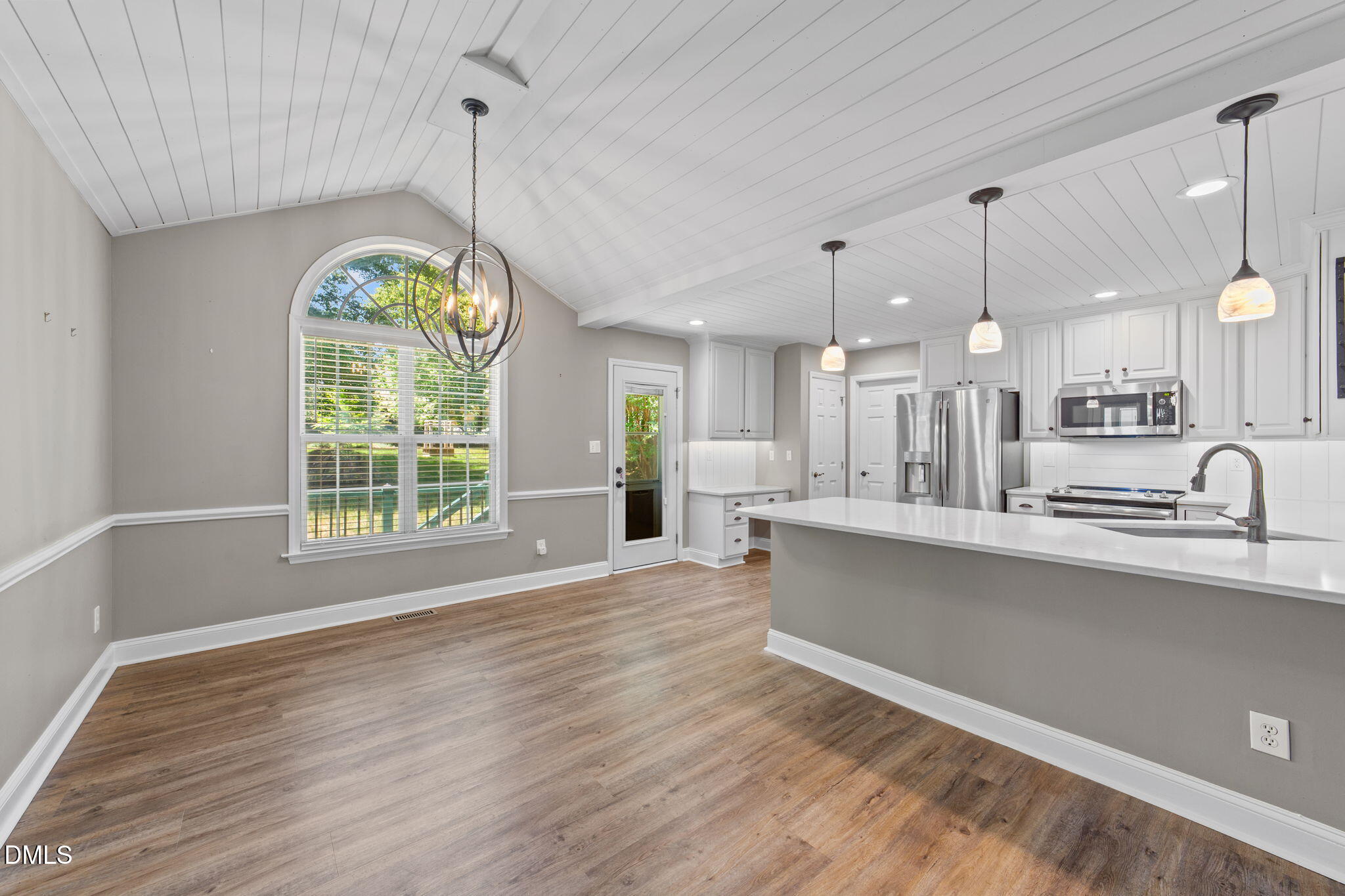 6820 Oviedo Drive Raleigh, NC 27603 - Photo 15 of 50 a view of a kitchen and a window