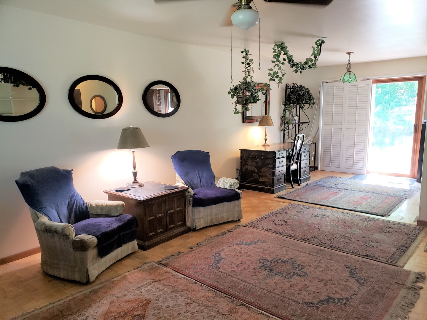 18719 Crowley Road Harvard, IL 60033 - Photo 2 of 22 a living room with furniture a clock and a chandelier