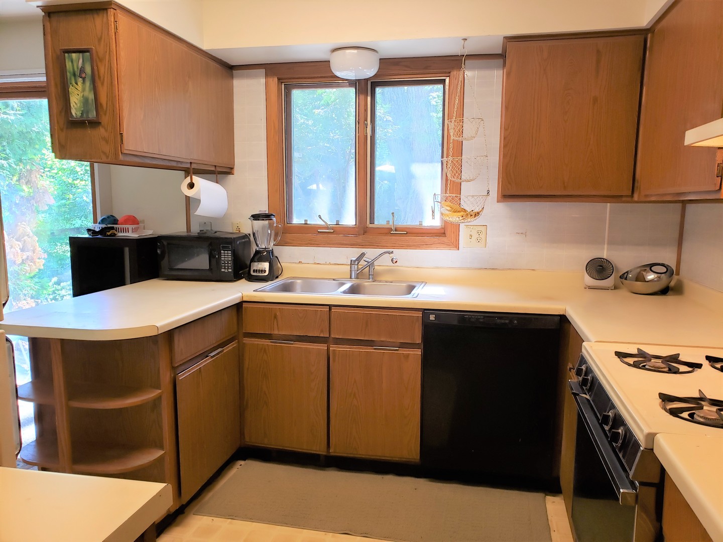 18719 Crowley Road Harvard, IL 60033 - Photo 8 of 22 a kitchen with a sink stove and cabinets