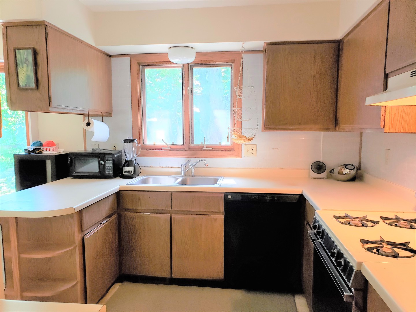 18719 Crowley Road Harvard, IL 60033 - Photo 9 of 22 a kitchen with a sink cabinets and window