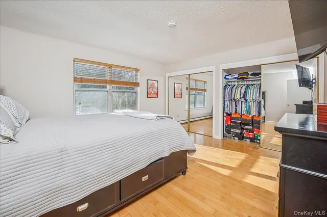 a spacious bedroom with a bed and a walk in closet