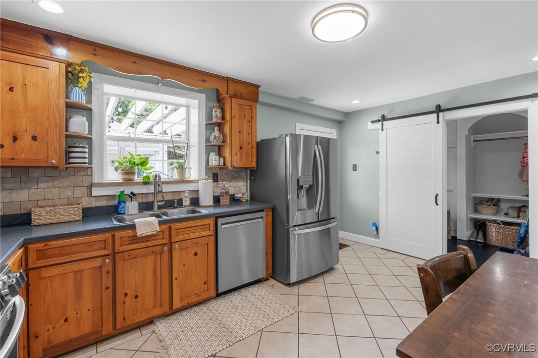 13923 White Oak Drive Lanexa, VA 23089 - Photo 36 of 46 a kitchen with stainless steel appliances granite countertop a refrigerator and a sink