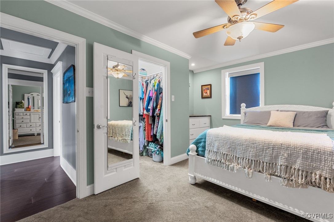 13923 White Oak Drive Lanexa, VA 23089 - Photo 10 of 46 a bedroom with a bed and a chandelier