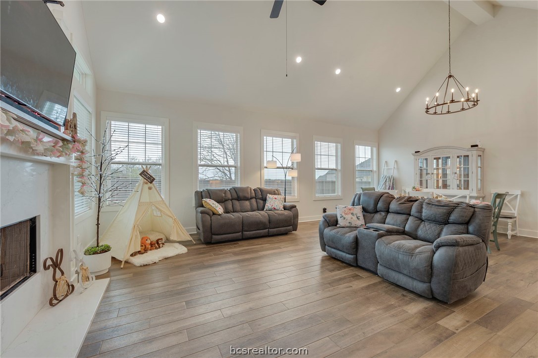 4357 Fox River Lane Bryan, TX 77802 - Photo 10 of 24 a living room with furniture and a chandelier