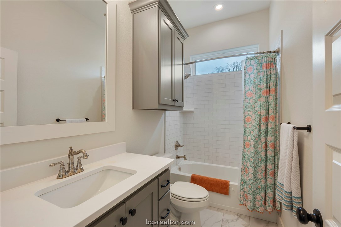 4357 Fox River Lane Bryan, TX 77802 - Photo 11 of 24 a bathroom with a sink toilet and shower