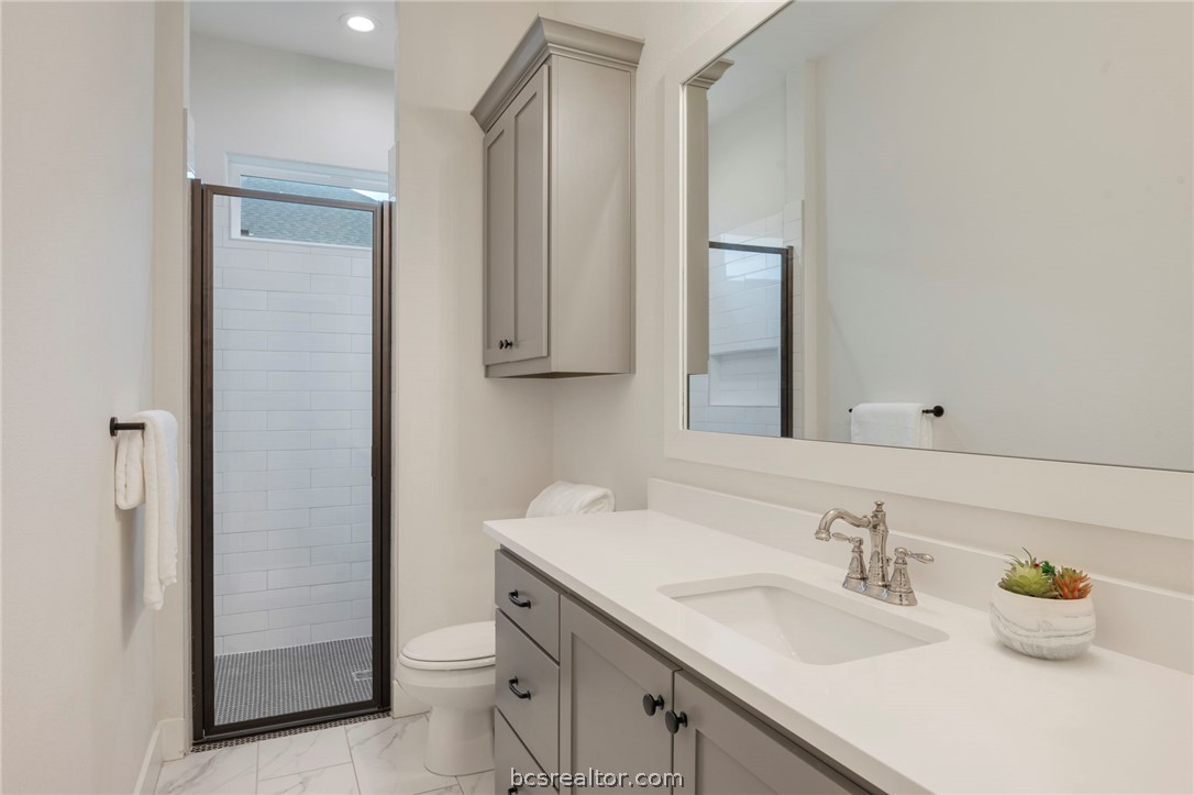 4357 Fox River Lane Bryan, TX 77802 - Photo 15 of 24 a bathroom with a sink and a mirror