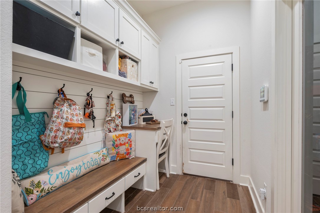 4357 Fox River Lane Bryan, TX 77802 - Photo 19 of 24 a view of walk in closet with clothes and shoes
