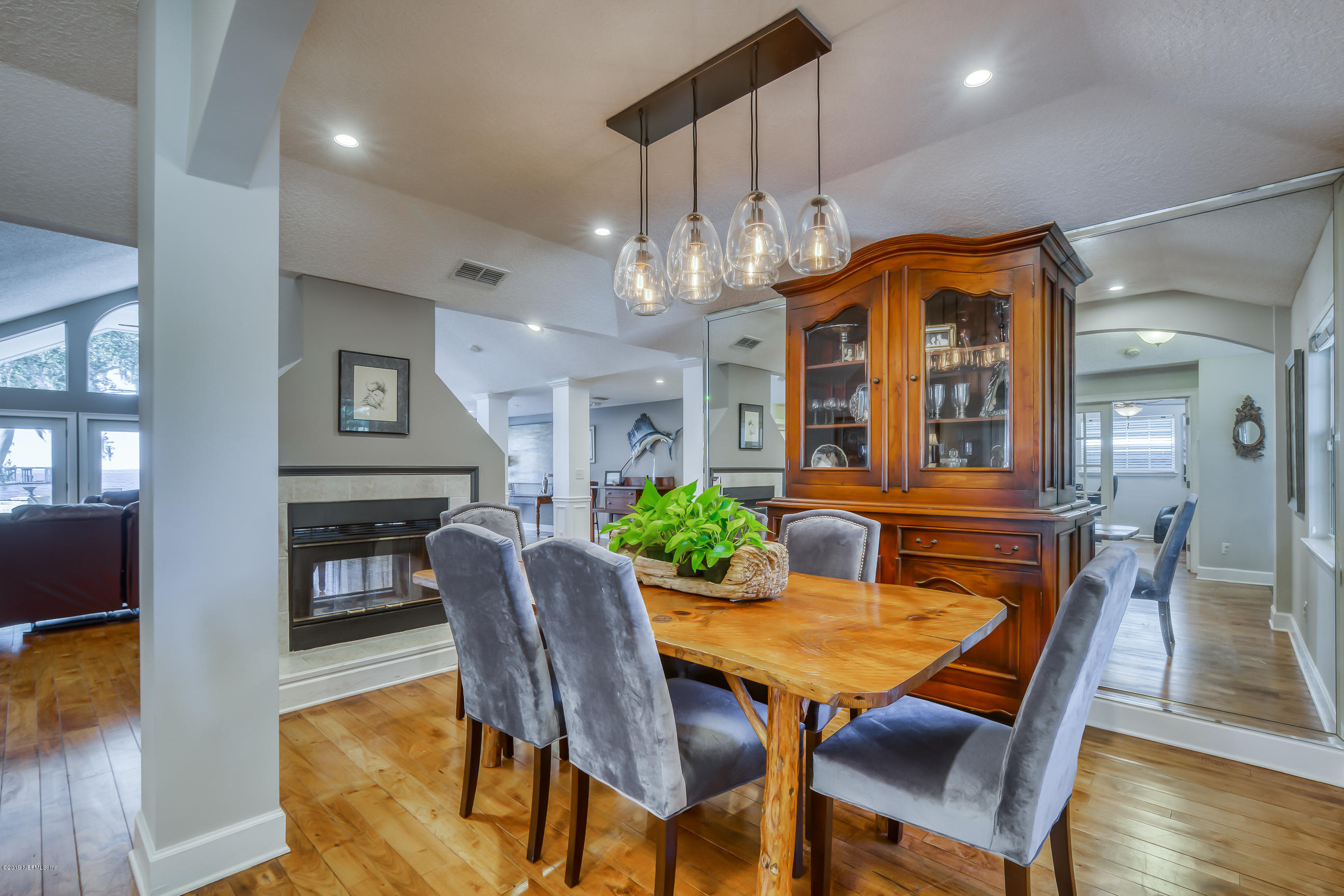 1105 Popolee Road St. Johns, FL 32259 - Photo 17 of 81 a dining room with furniture a chandelier and wooden floor