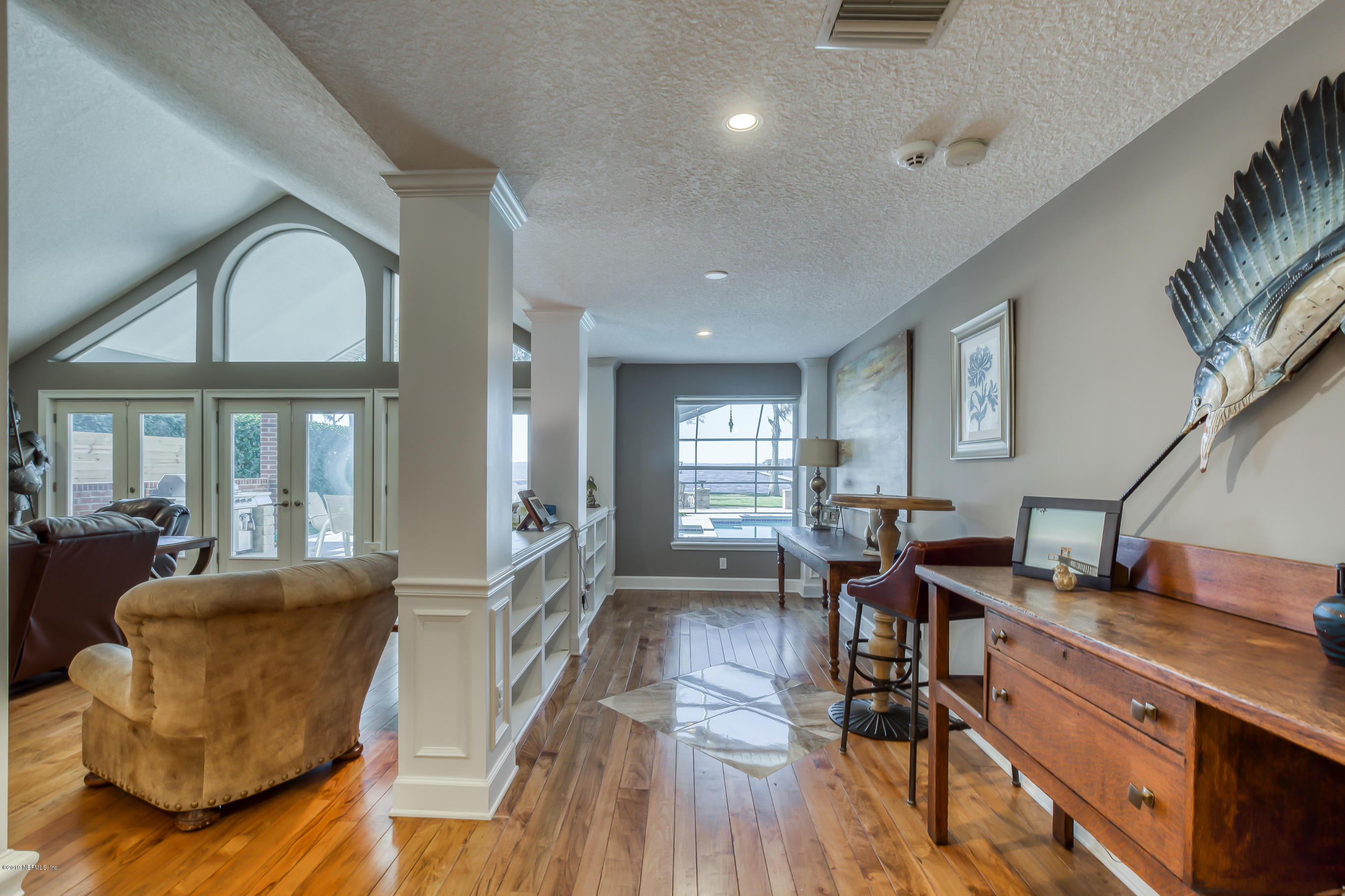 1105 Popolee Road St. Johns, FL 32259 - Photo 26 of 81 a living room with furniture and a wooden floor