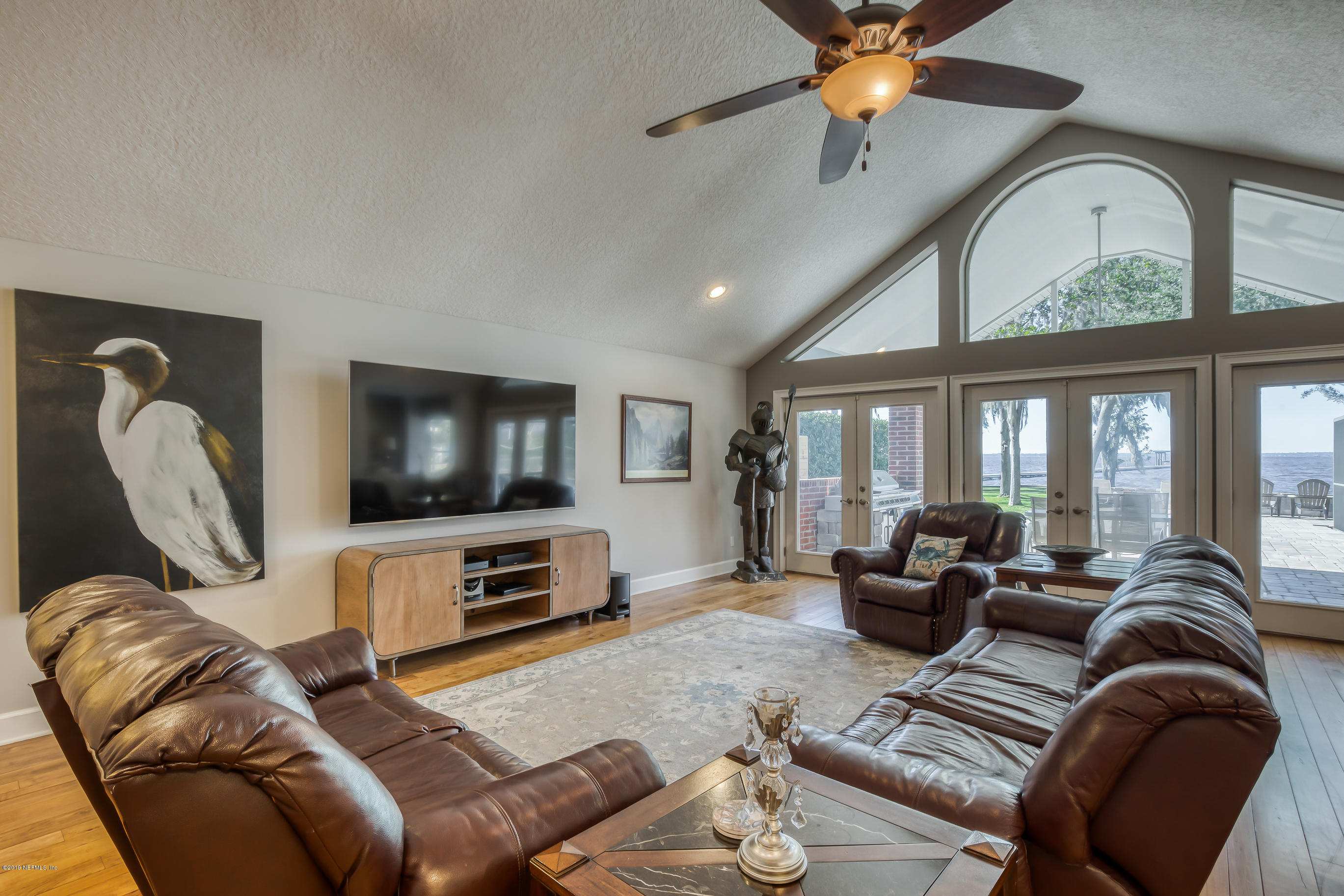 1105 Popolee Road St. Johns, FL 32259 - Photo 27 of 81 a living room with furniture ceiling fan and a flat screen tv