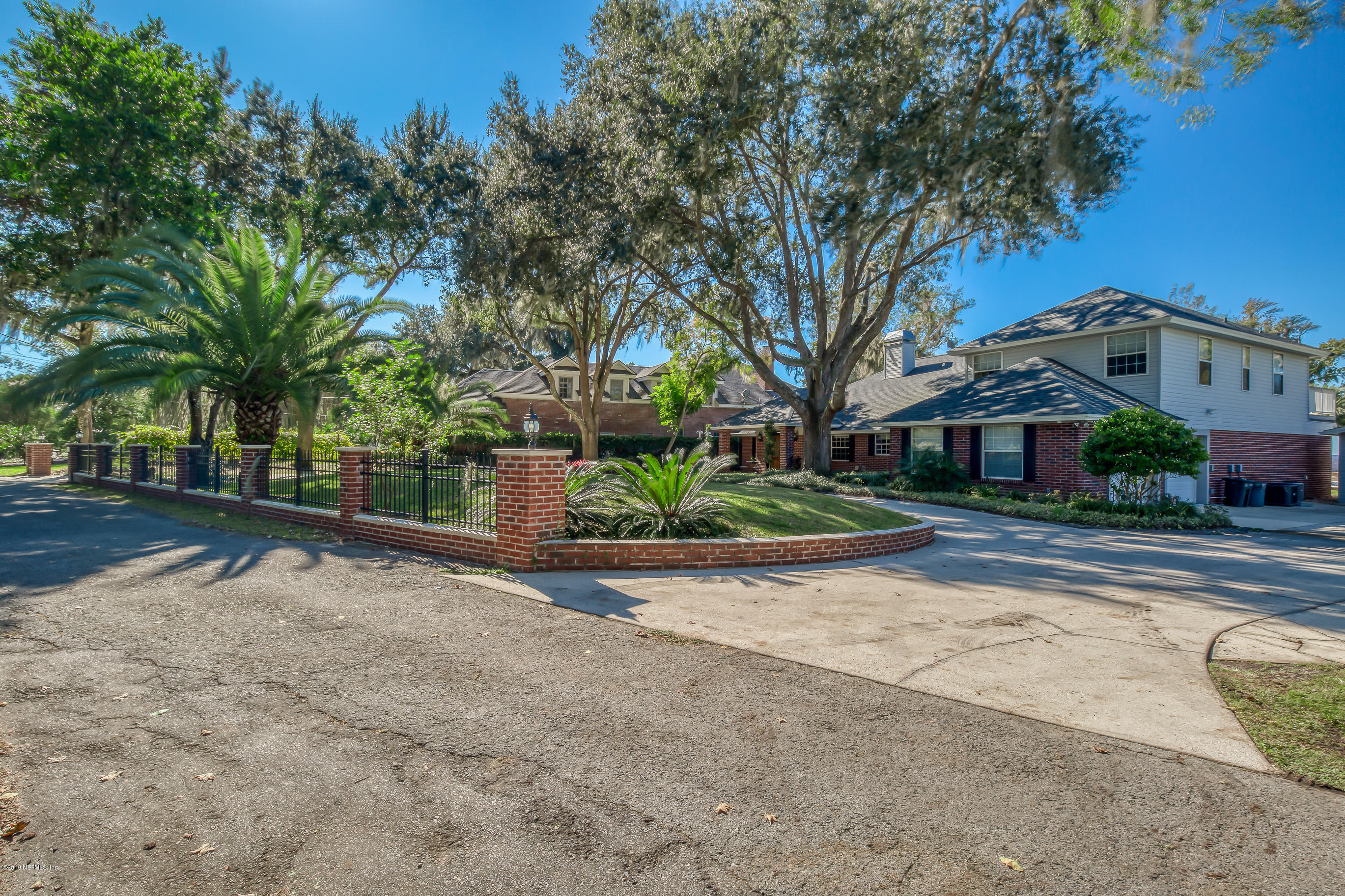 1105 Popolee Road St. Johns, FL 32259 - Photo 34 of 81 a front view of a house with a yard and potted plants