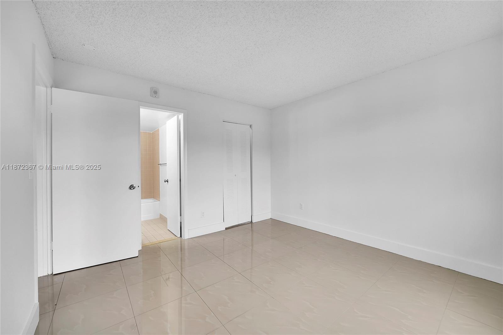 8260 Southwest 210th Street, Unit 201 Cutler Bay, FL 33189 - Photo 19 of 33 a view of an empty room