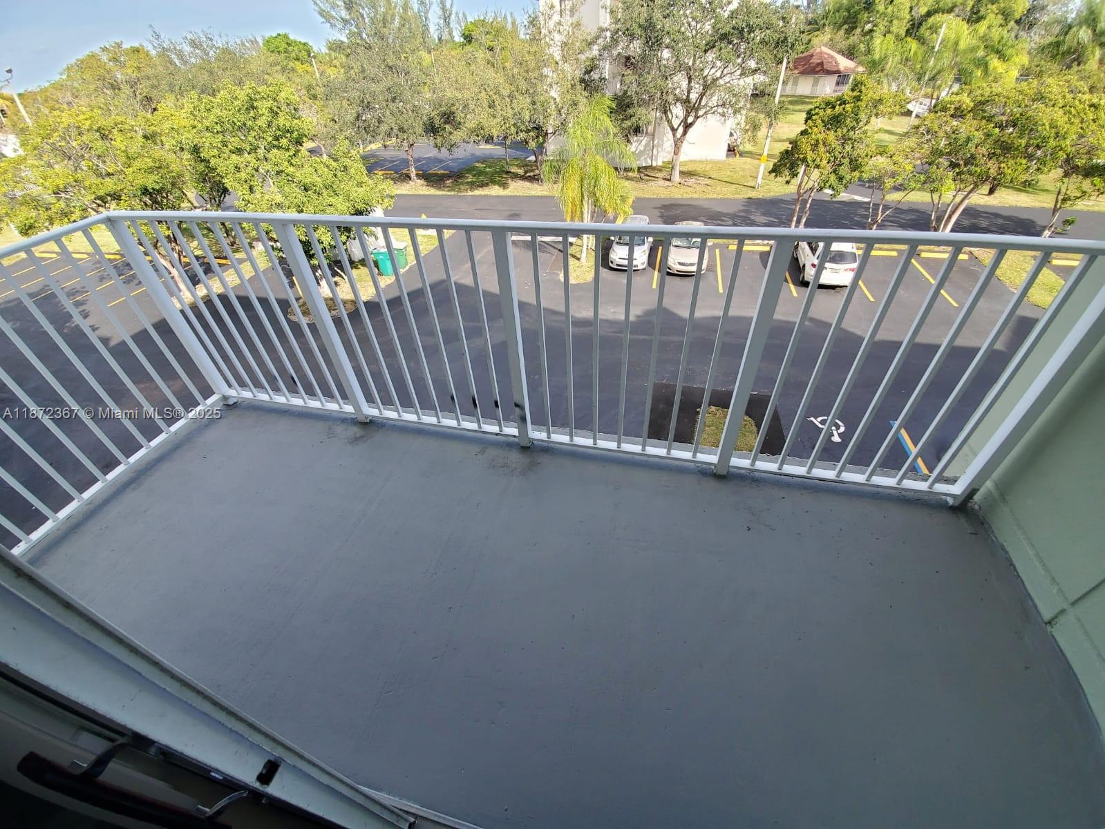 8260 Southwest 210th Street, Unit 201 Cutler Bay, FL 33189 - Photo 25 of 33 a view of balcony with wooden floor