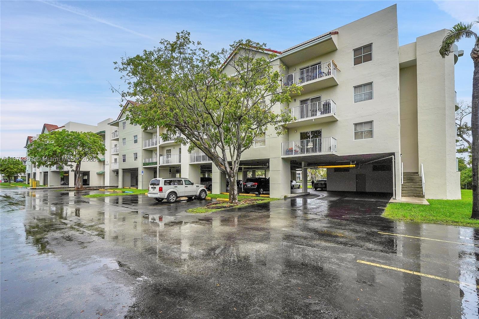 8260 Southwest 210th Street, Unit 201 Cutler Bay, FL 33189 - Photo 32 of 33 a view of a building with many windows
