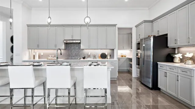 a kitchen with kitchen island a appliances cabinets and a counter top space