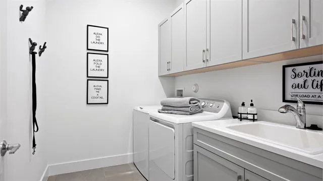 a bathroom with a sink and cabinets