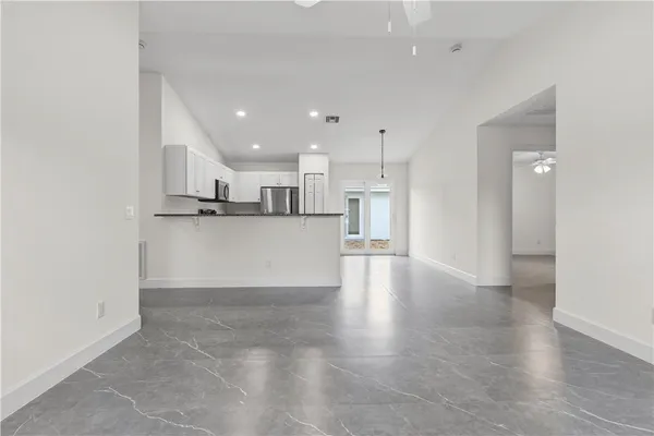 a view of kitchen with wooden floor