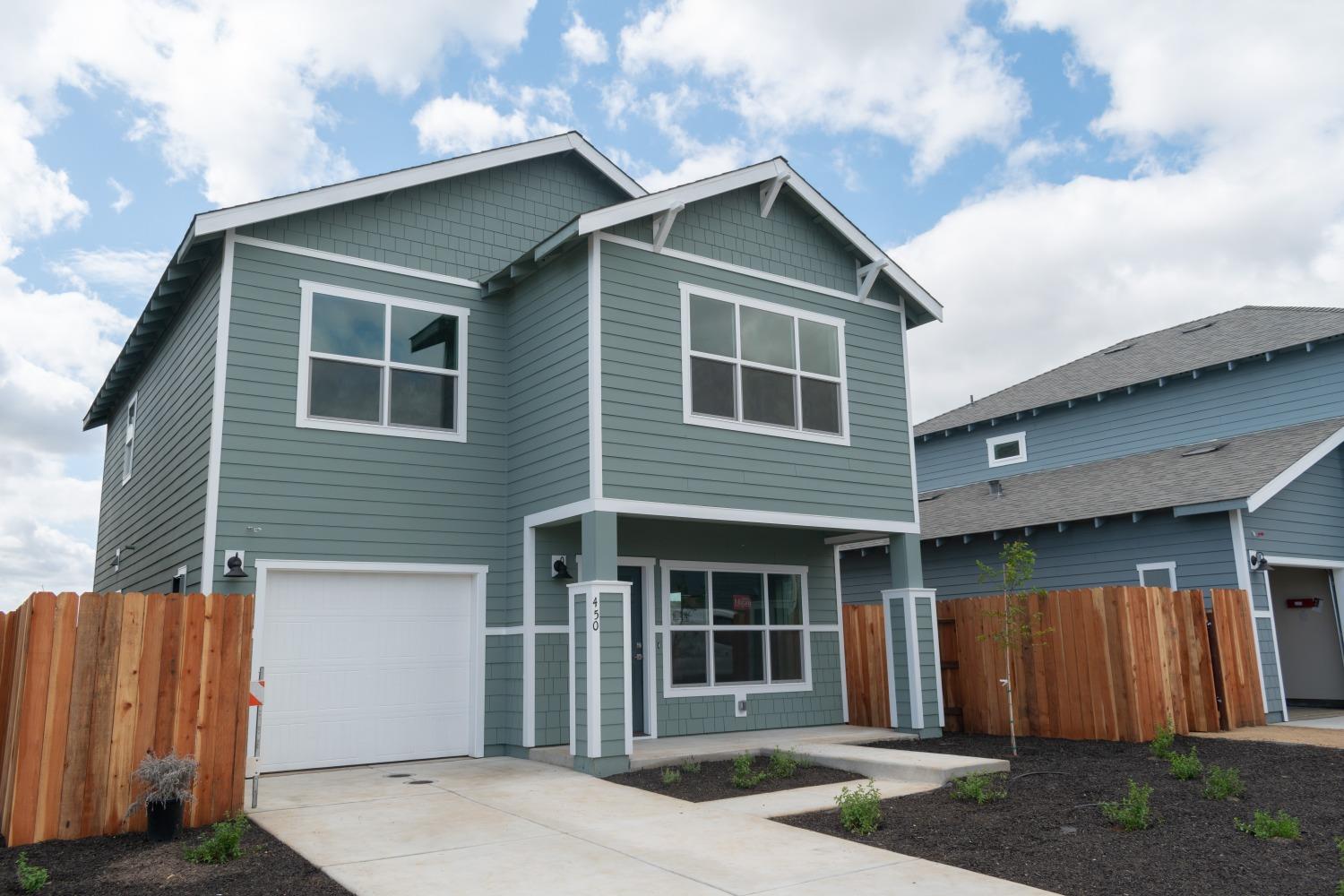 a front view of a house with a garage
