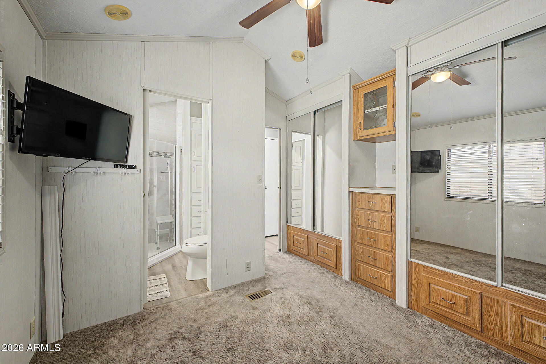 7750 East Broadway Road, Unit 560 Mesa, AZ 85208 - Photo 10 of 18 a view of a livingroom with a flat screen tv