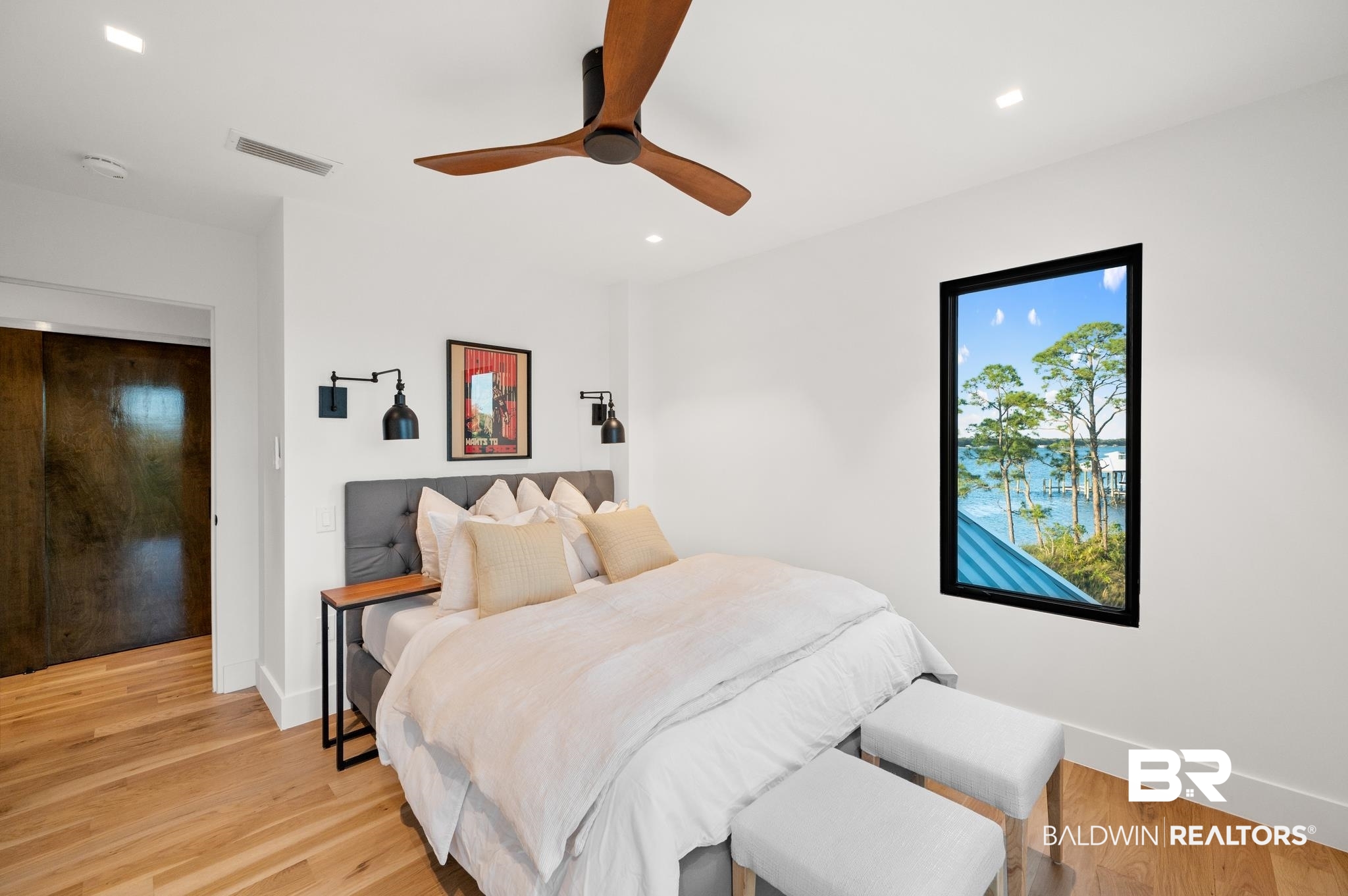 33349 River Road Orange Beach, AL 36561 - Photo 22 of 61 Room featuring wood-finish flooring and white walls