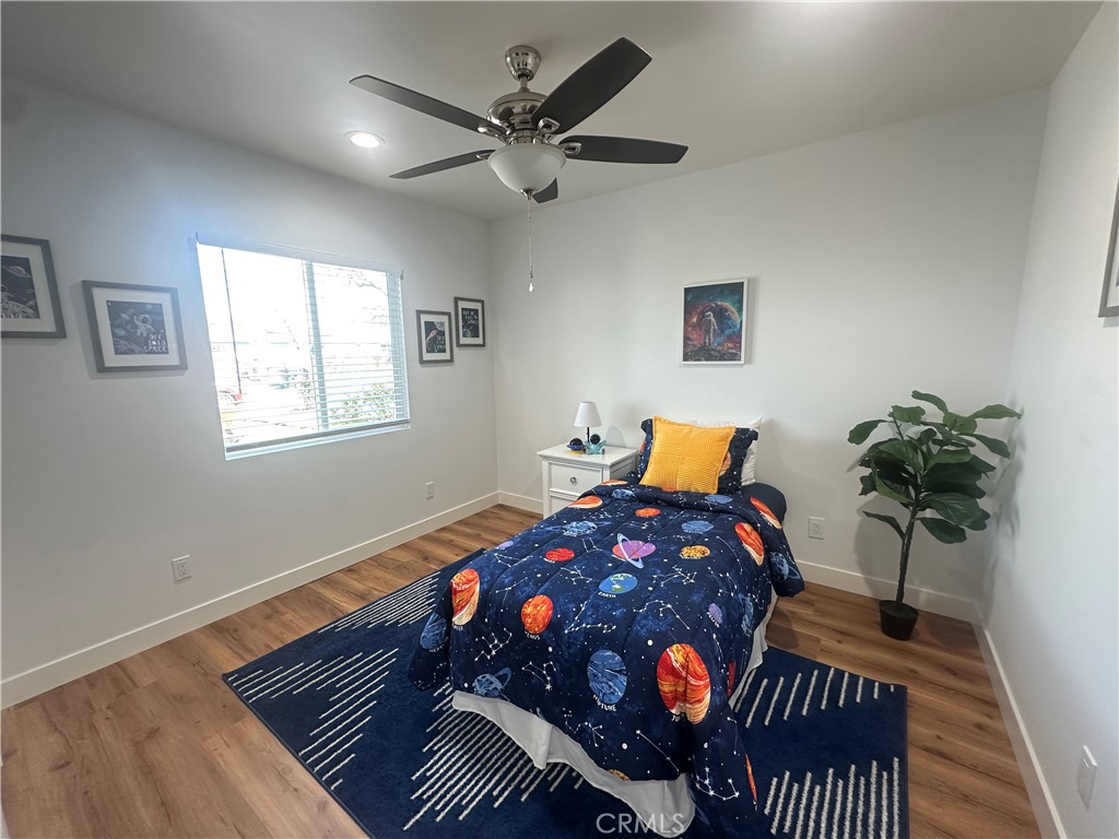 12158 Oracle Street Norwalk, CA 90650 - Photo 14 of 22 a bed sitting in a bedroom next to a window