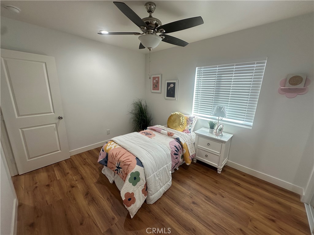 12158 Oracle Street Norwalk, CA 90650 - Photo 15 of 22 a bedroom with a bed and a window