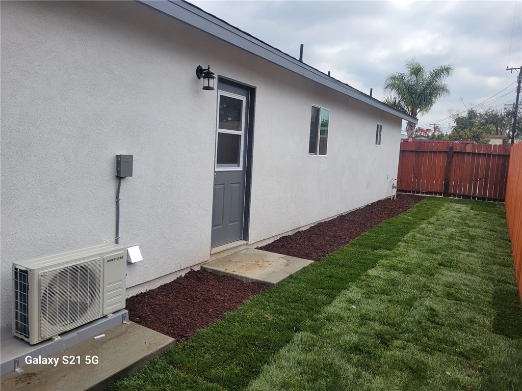 12158 Oracle Street Norwalk, CA 90650 - Photo 20 of 22 a front view of a house with yard