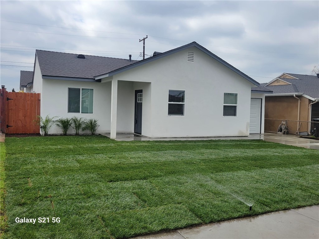 12158 Oracle Street Norwalk, CA 90650 - Photo 22 of 22 a front view of house with yard