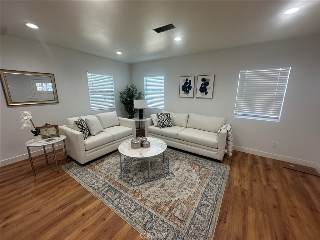 12158 Oracle Street Norwalk, CA 90650 - Photo 3 of 22 a living room with furniture and a rug