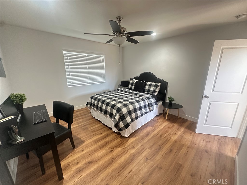12158 Oracle Street Norwalk, CA 90650 - Photo 7 of 22 a bedroom with a bed window and a desk