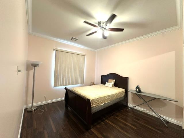 6830 North 14th Street Phoenix, AZ 85014 - Photo 21 of 28 a bedroom with a bed and a chandelier