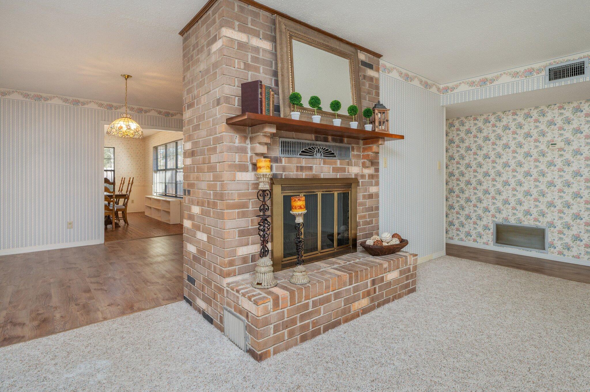 5836 Dairy Road Baker, FL 32531 - Photo 13 of 65 a living room with furniture and a fireplace