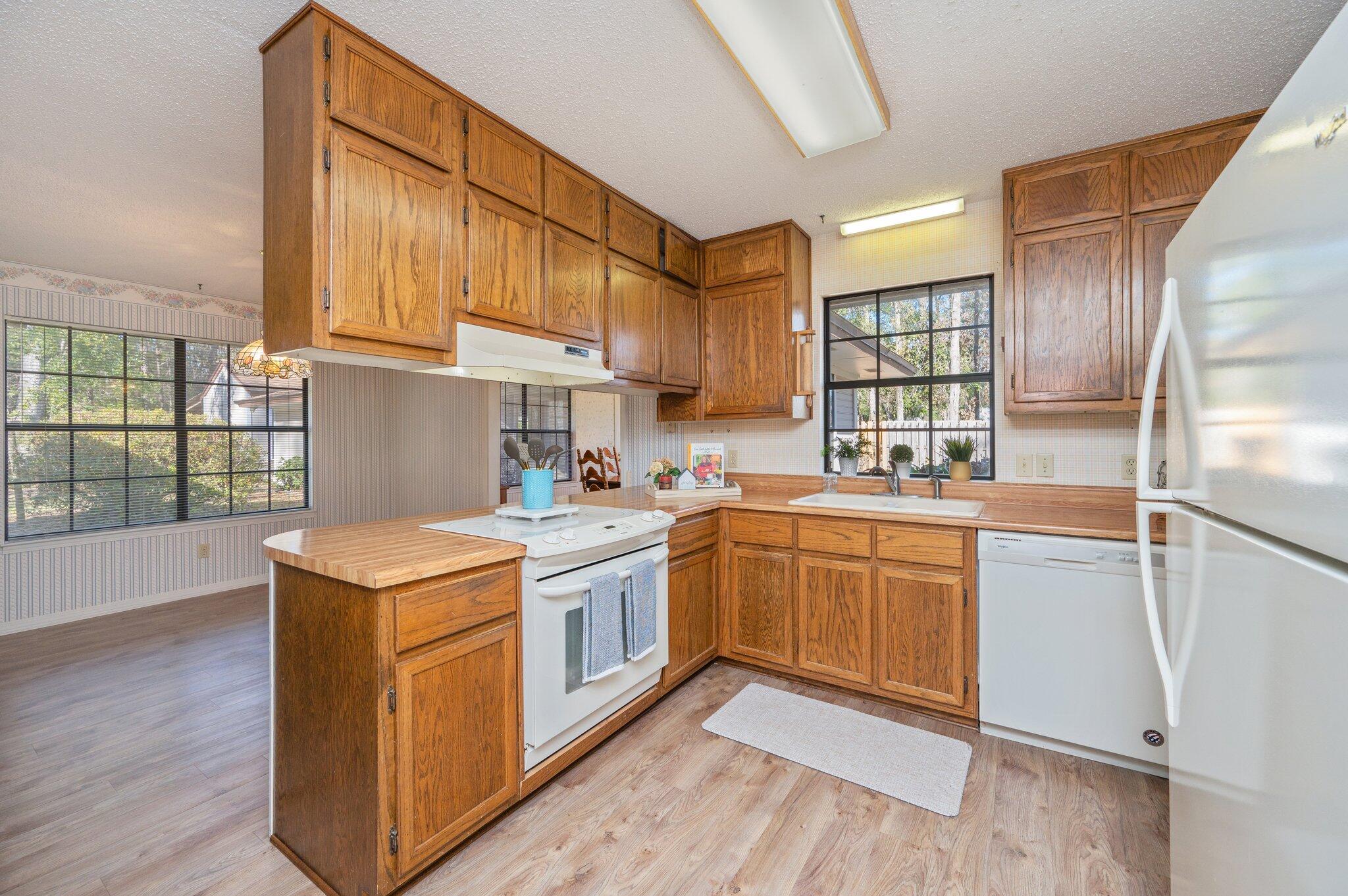 5836 Dairy Road Baker, FL 32531 - Photo 16 of 65 a kitchen with stainless steel appliances granite countertop a stove a sink dishwasher and a refrigerator