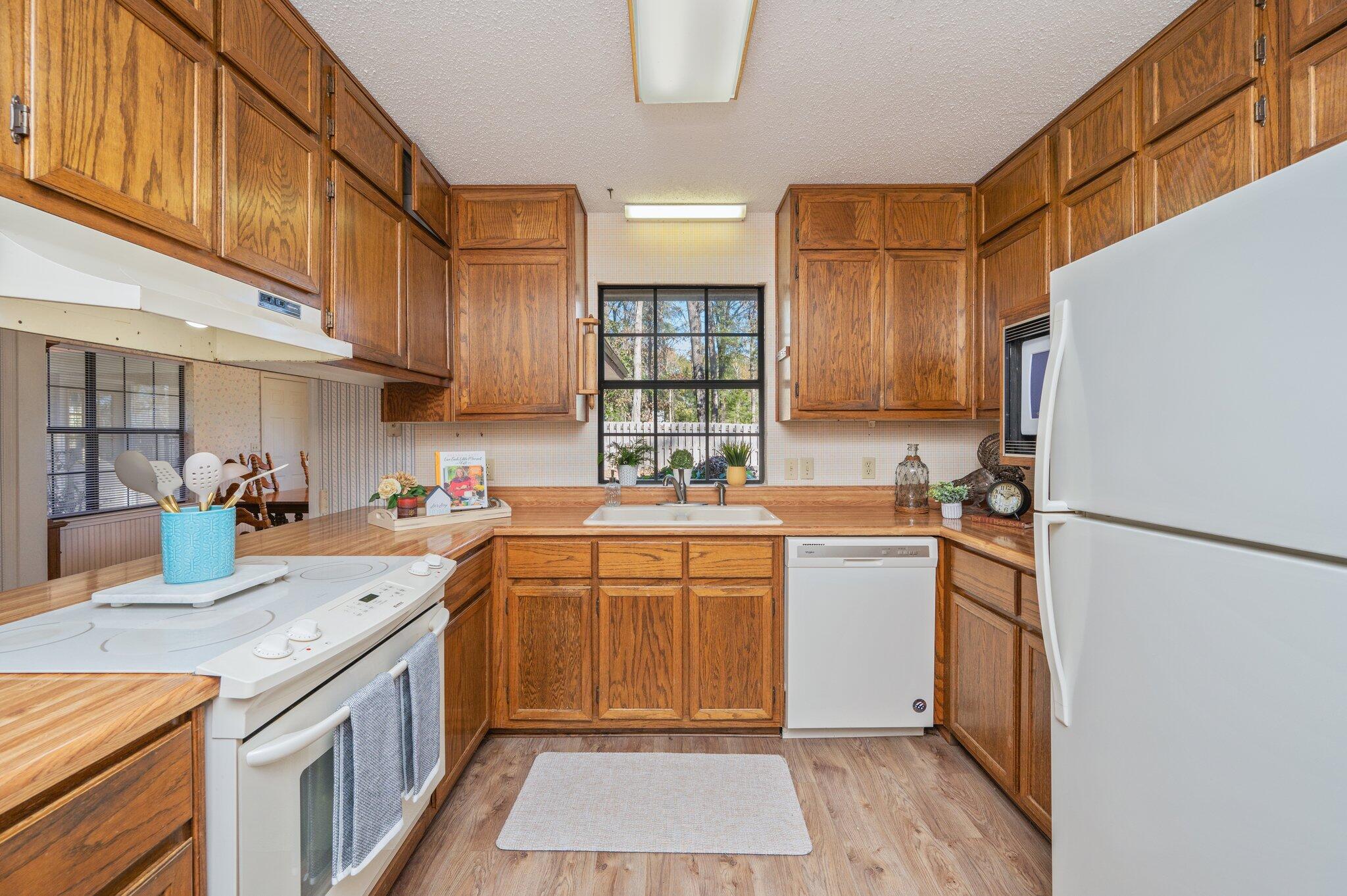 5836 Dairy Road Baker, FL 32531 - Photo 17 of 65 a kitchen with a sink stove and refrigerator