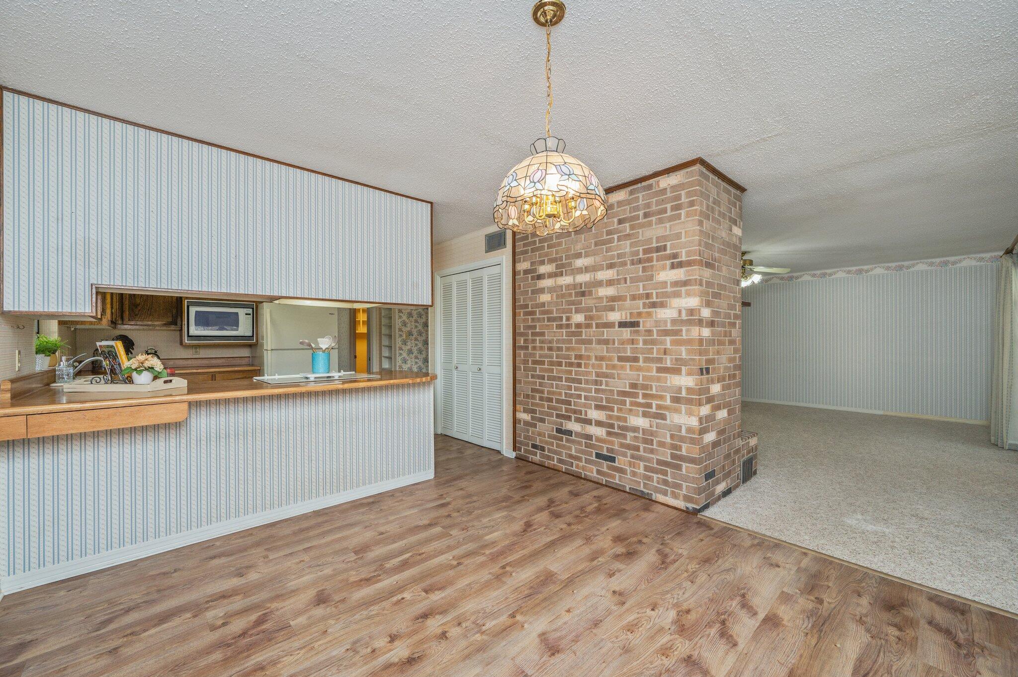 5836 Dairy Road Baker, FL 32531 - Photo 25 of 65 a view of livingroom with kitchen island with wooden floor