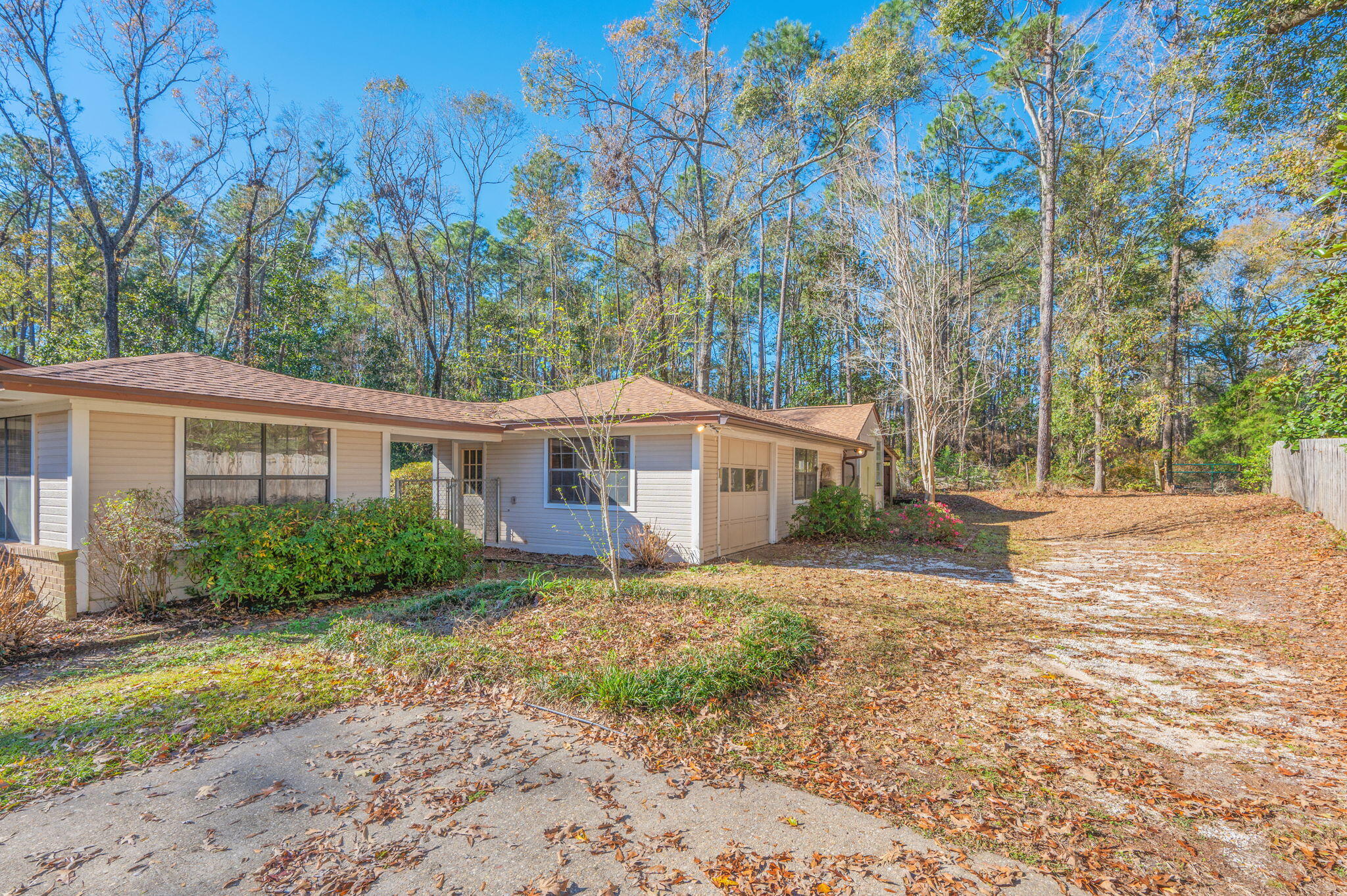 5836 Dairy Road Baker, FL 32531 - Photo 3 of 65 a view of a yard in front of a house with large trees
