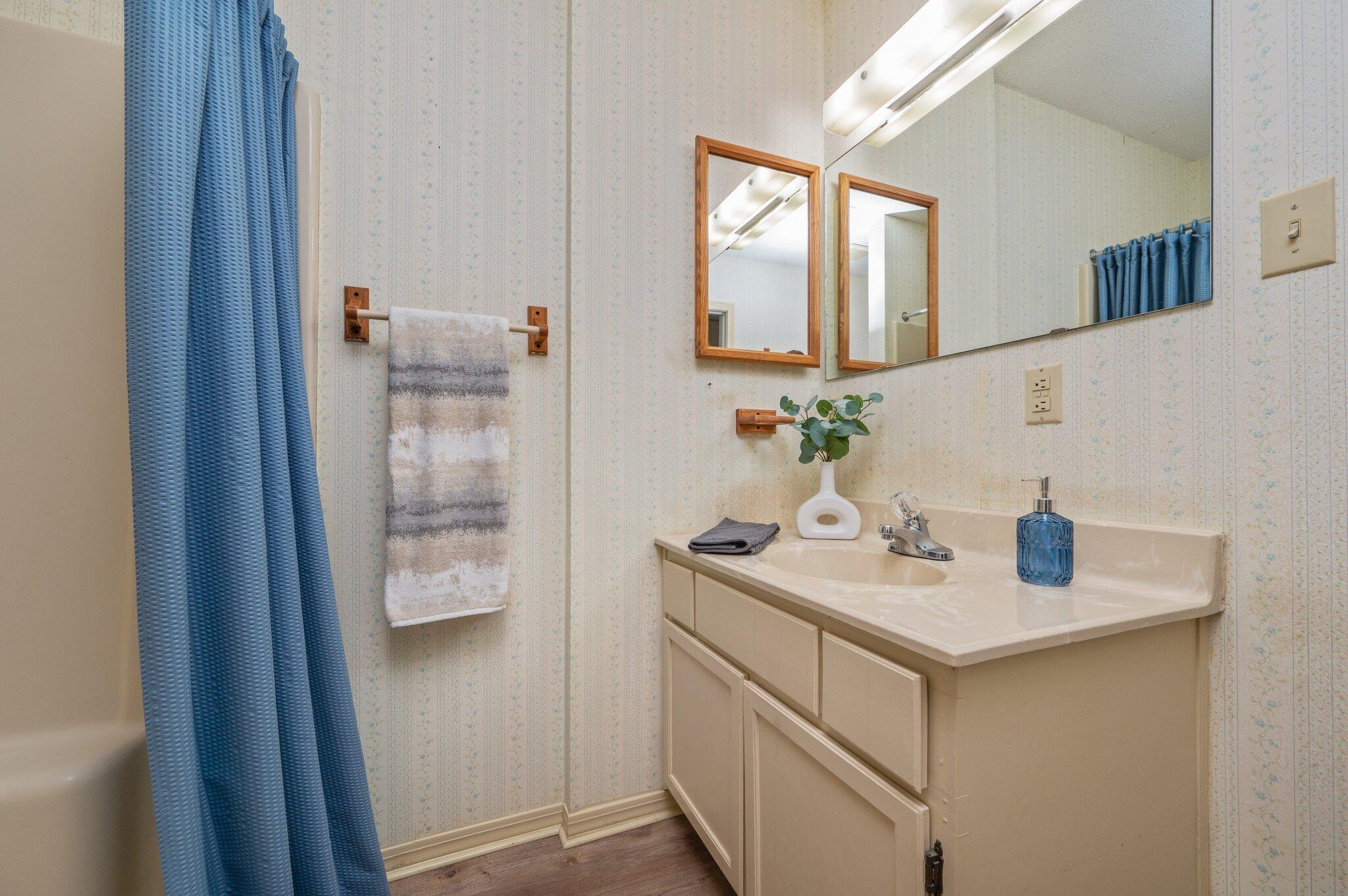 5836 Dairy Road Baker, FL 32531 - Photo 34 of 65 a bathroom with a sink and a mirror