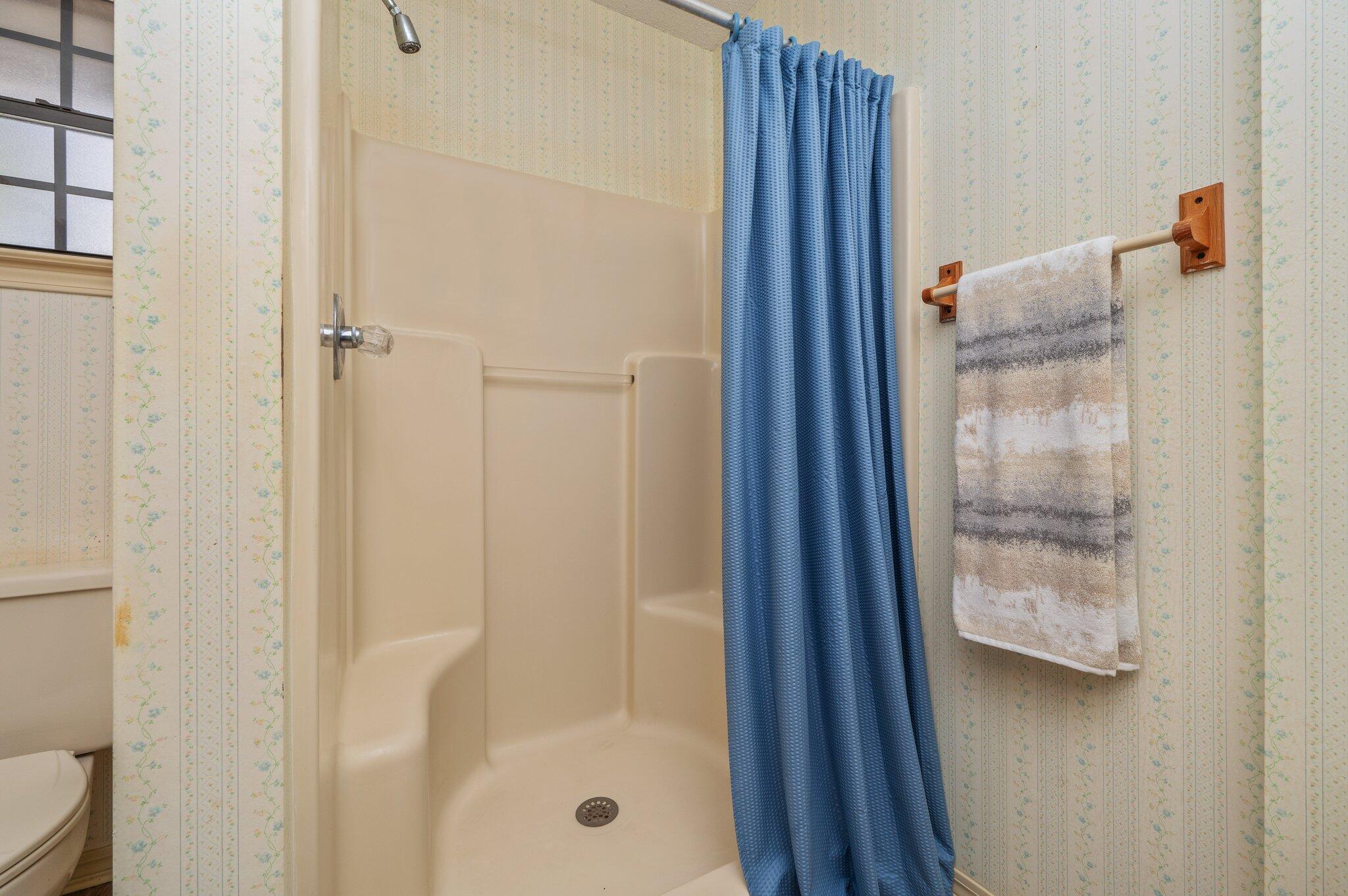 5836 Dairy Road Baker, FL 32531 - Photo 35 of 65 a bathroom with a glass shower door