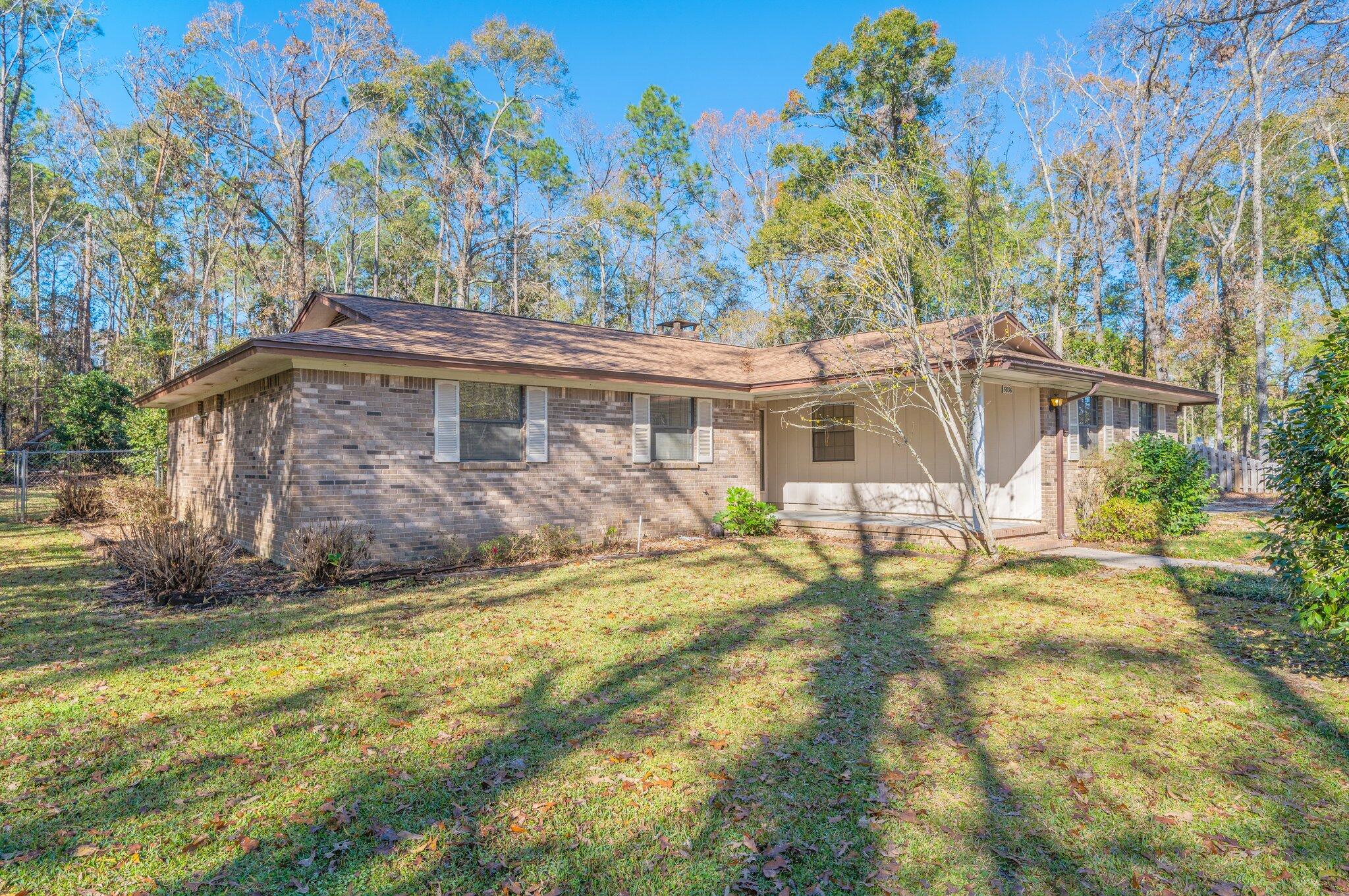 5836 Dairy Road Baker, FL 32531 - Photo 4 of 65 a view of a house with a yard